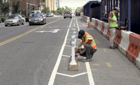 Video: DDOT Installs Bike Lane Barrier Using Repurposed Wood