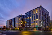 New 13-Story Facade Echos Nearby Audi Stadium Crowds