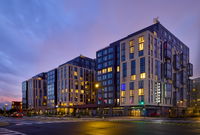 New 13-Story Facade Echos Nearby Audi Stadium Crowds