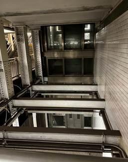 A metal frame with windows<br />
<br />
AI-generated content may be incorrect.